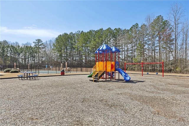 communal playground featuring fence