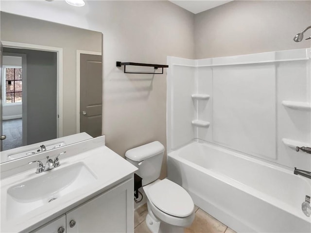 full bath with shower / bath combination, tile patterned flooring, vanity, and toilet