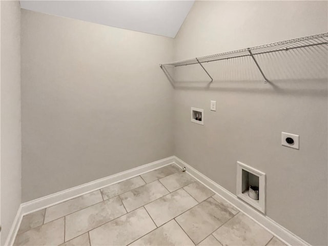 clothes washing area featuring hookup for a washing machine, hookup for an electric dryer, gas dryer hookup, laundry area, and baseboards