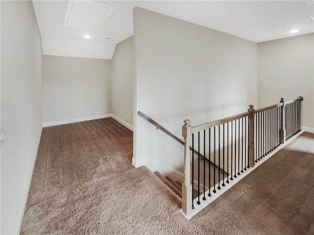 interior space with carpet, baseboards, vaulted ceiling, and recessed lighting