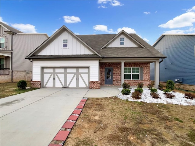 view of front of home with a garage, concrete driveway, brick siding, and board and batten siding