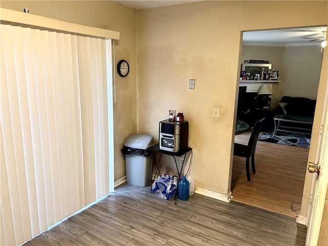 interior space with crown molding and hardwood / wood-style floors