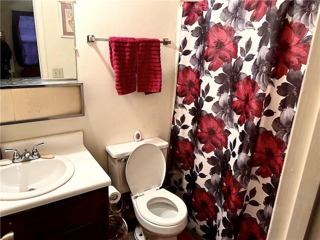 bathroom featuring vanity and toilet