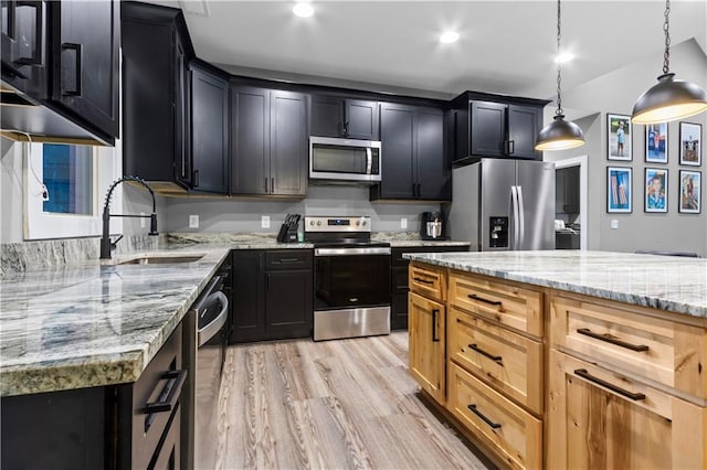 1441 Whitestone Rd, Talking Rock, GA 30175 - kitchen with appliances with stainless steel finishes, dark cabinets, a sink, light stone countertops, and light wood-style floors