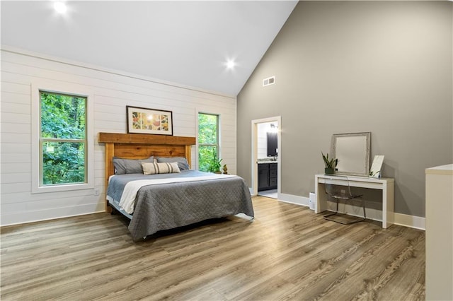 1441 Whitestone Rd, Talking Rock, GA 30175 - bedroom featuring high vaulted ceiling, wood finished floors, baseboards, connected bathroom, and wood walls