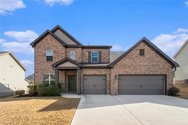 view of front of house featuring concrete driveway and brick siding