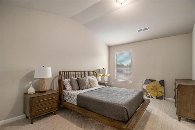 bedroom featuring lofted ceiling, carpet, visible vents, and baseboards