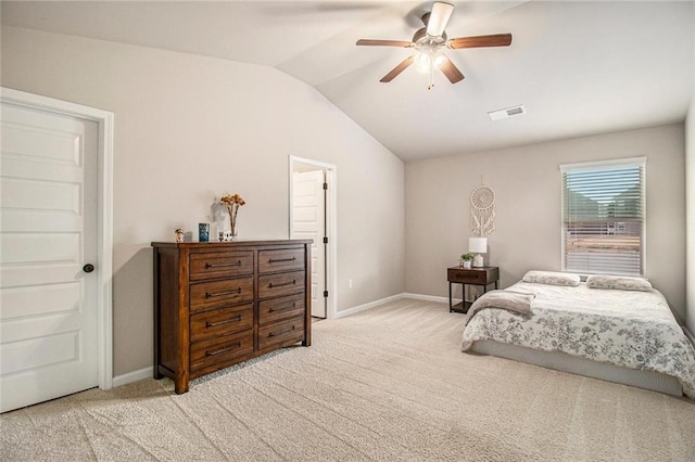 bedroom with lofted ceiling, baseboards, visible vents, and light colored carpet