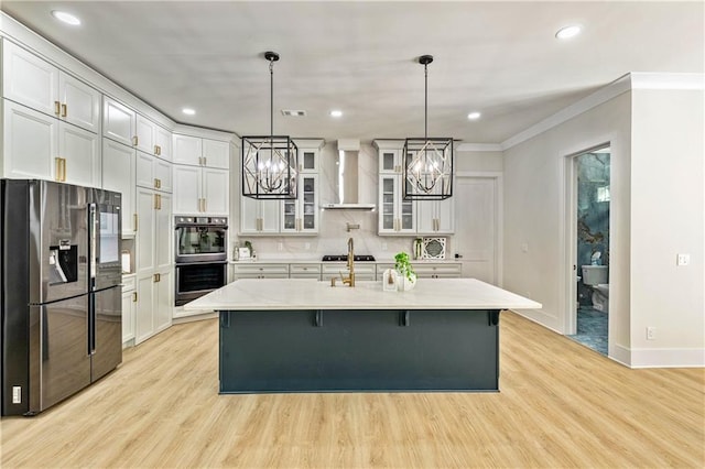 2634 Greenes Ln, Powder Springs, GA 30127 - kitchen with light countertops, an inviting chandelier, glass insert cabinets, black appliances, and wall chimney exhaust hood