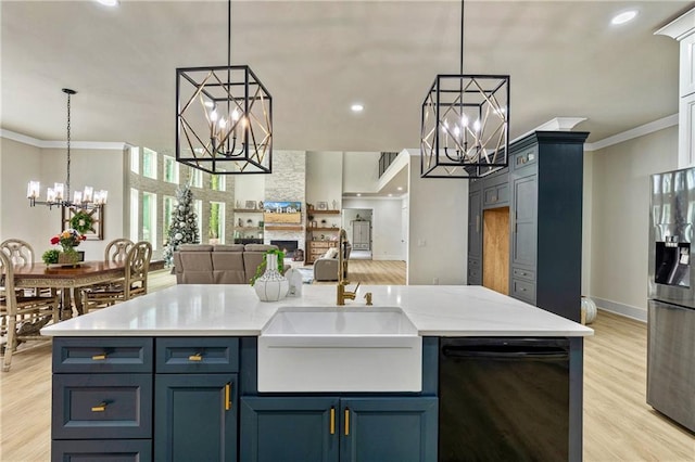 2634 Greenes Ln, Powder Springs, GA 30127 - kitchen with stainless steel fridge with ice dispenser, ornamental molding, open floor plan, hanging light fixtures, and a chandelier