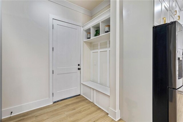 2634 Greenes Ln, Powder Springs, GA 30127 - mudroom featuring ornamental molding, light wood-type flooring, and baseboards