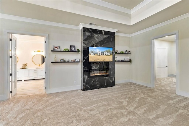 2634 Greenes Ln, Powder Springs, GA 30127 - living room featuring baseboards, visible vents, light colored carpet, crown molding, and a high end fireplace