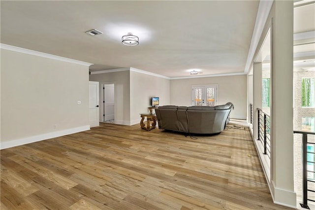 2634 Greenes Ln, Powder Springs, GA 30127 - living area with visible vents, baseboards, french doors, light wood finished floors, and crown molding
