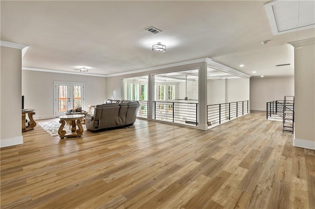 2634 Greenes Ln, Powder Springs, GA 30127 - living area with attic access, visible vents, light wood-style flooring, and ornamental molding