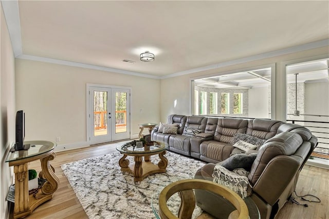 2634 Greenes Ln, Powder Springs, GA 30127 - living room with light wood-style floors, visible vents, ornamental molding, and french doors