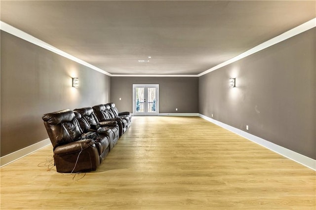 2634 Greenes Ln, Powder Springs, GA 30127 - living area featuring light wood-style floors, french doors, ornamental molding, and baseboards