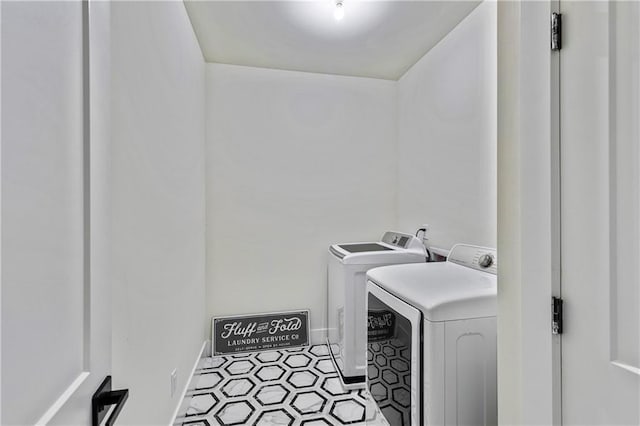 2634 Greenes Ln, Powder Springs, GA 30127 - laundry area with baseboards, laundry area, and washer and dryer