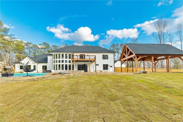 2634 Greenes Ln, Powder Springs, GA 30127 - back of house with fence, an outdoor pool, and a yard