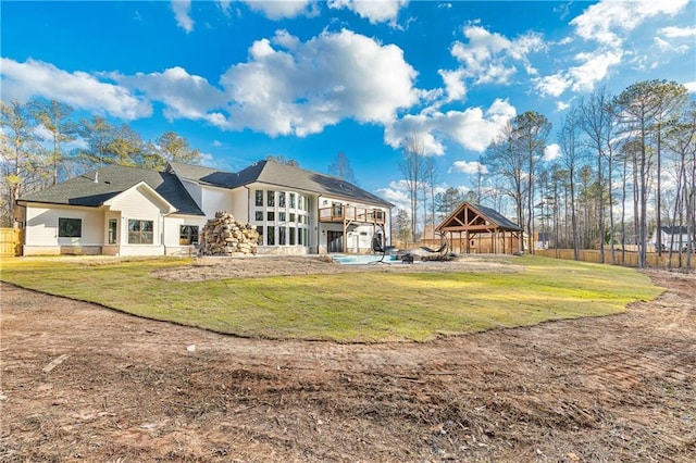 2634 Greenes Ln, Powder Springs, GA 30127 - rear view of house with a lawn and a gazebo