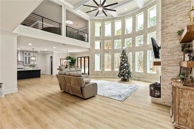 2634 Greenes Ln, Powder Springs, GA 30127 - living room featuring beamed ceiling, plenty of natural light, and wood finished floors
