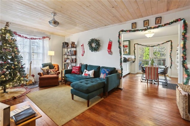 living room with crown molding, wooden ceiling, and hardwood / wood-style flooring