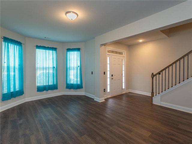 foyer featuring dark wood-type flooring