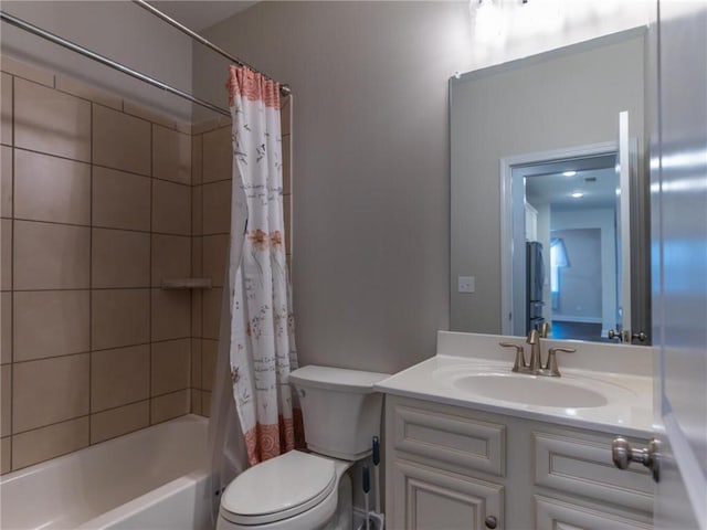 full bathroom featuring shower / bath combination with curtain, vanity, and toilet