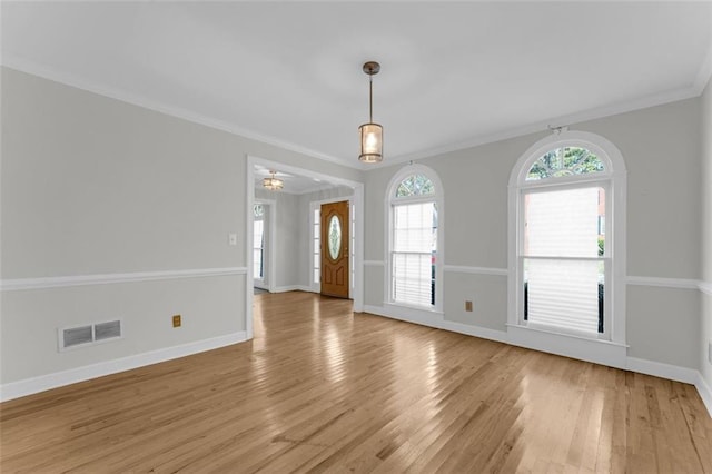 unfurnished room featuring light hardwood / wood-style flooring and ornamental molding