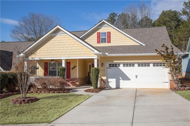 craftsman-style house with a garage, a porch, and a front lawn