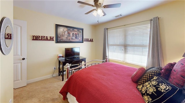 carpeted bedroom with ceiling fan