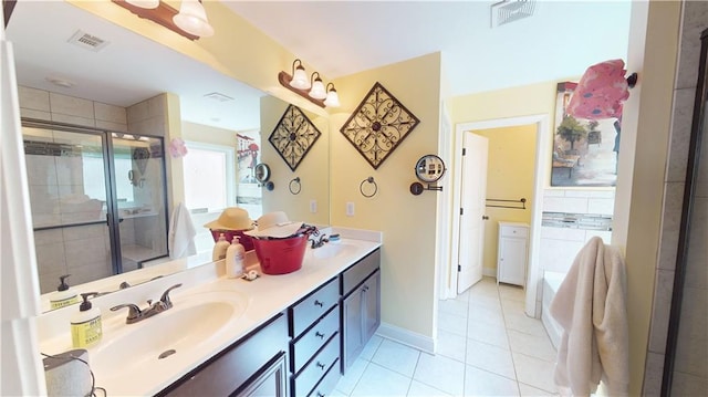 bathroom featuring walk in shower, vanity, and tile patterned flooring