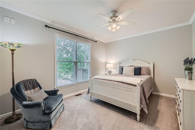 carpeted bedroom featuring crown molding, baseboards, and visible vents