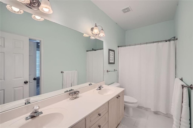 full bathroom featuring double vanity, visible vents, toilet, and a sink