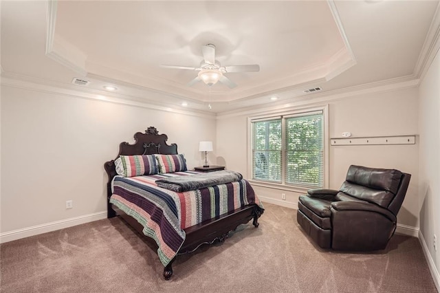 bedroom with a tray ceiling, carpet floors, baseboards, and ornamental molding