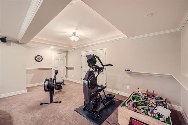 workout room featuring baseboards, carpet floors, and crown molding