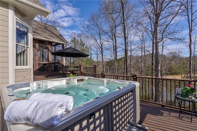 deck featuring a hot tub