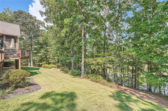 view of yard featuring a wooden deck