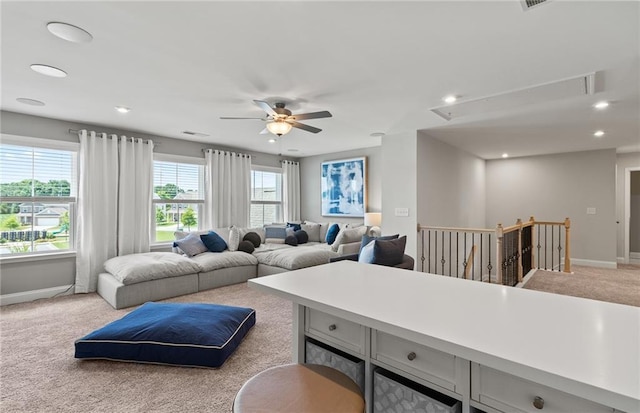 living room with light carpet and ceiling fan