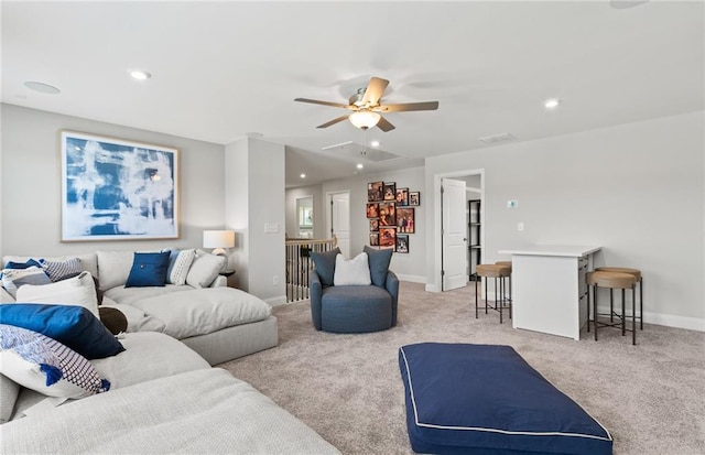 living room featuring light carpet and ceiling fan