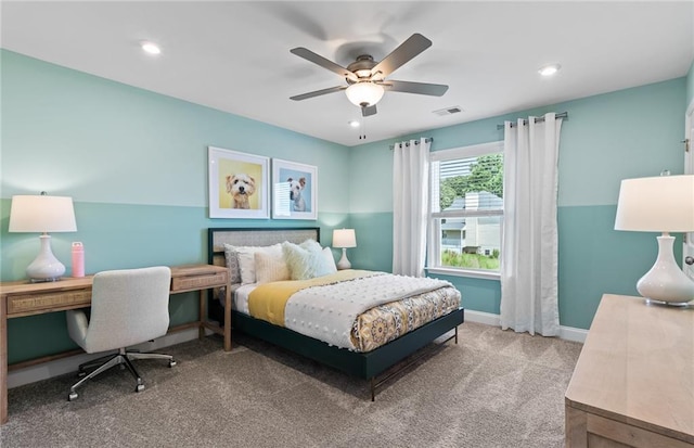 bedroom featuring ceiling fan and carpet