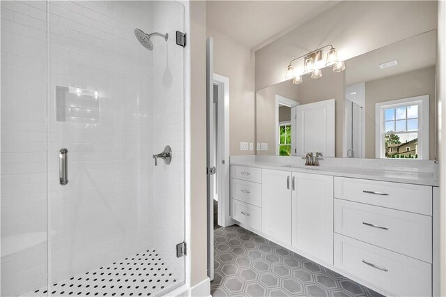 bathroom featuring vanity and walk in shower