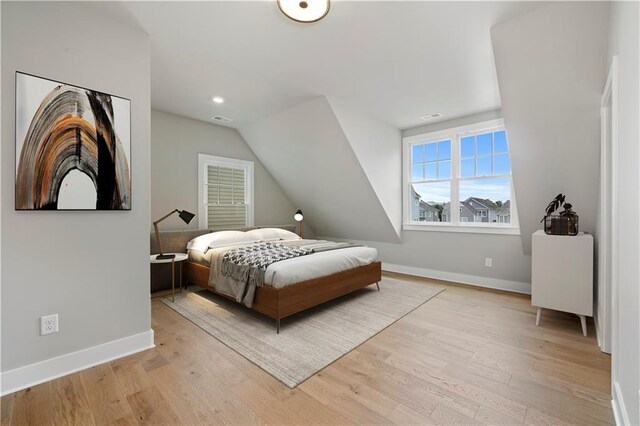 bedroom with light hardwood / wood-style flooring