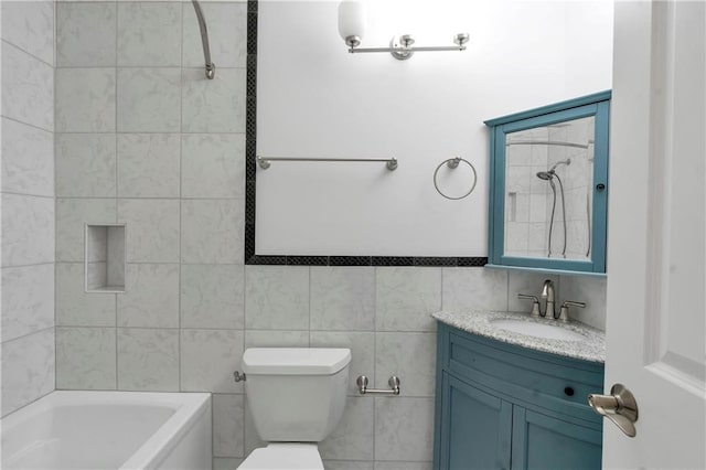 full bathroom featuring tile walls, toilet, vanity, and  shower combination