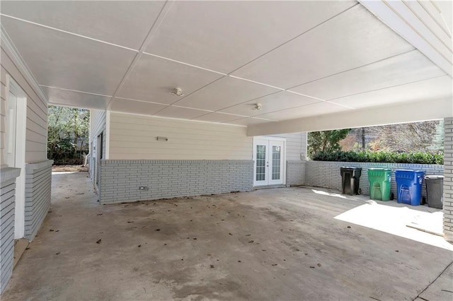 view of patio with french doors and fence