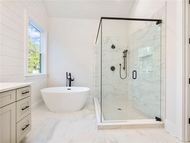 bathroom featuring vanity and shower with separate bathtub