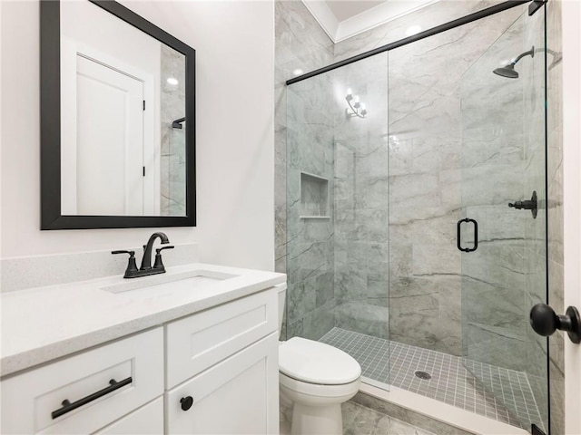 bathroom with walk in shower, vanity, and toilet