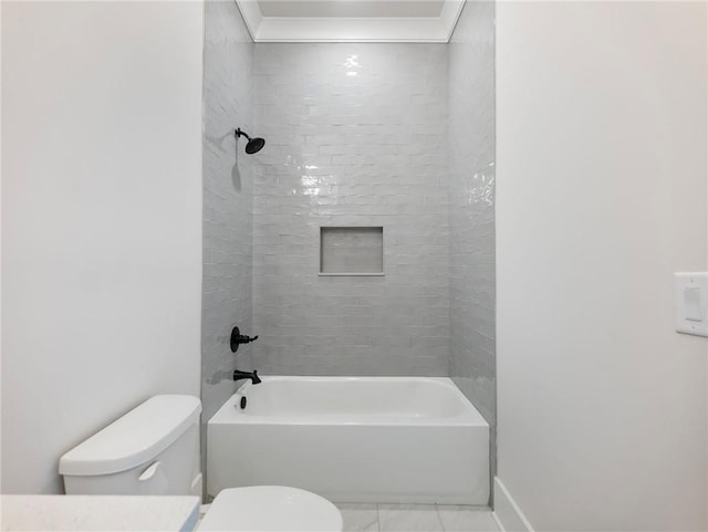 bathroom featuring tiled shower / bath and toilet