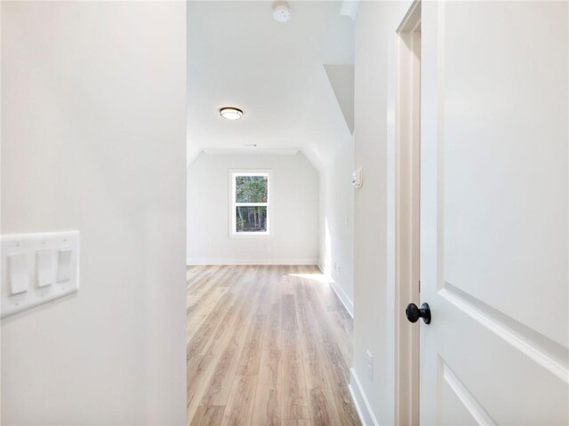 hallway with light hardwood / wood-style flooring