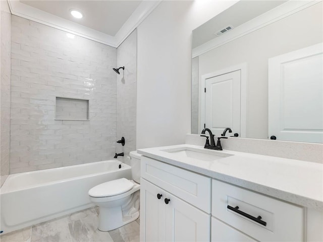 full bathroom featuring crown molding, vanity, tiled shower / bath combo, and toilet