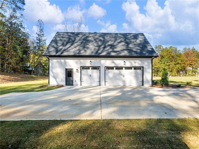 garage with a yard